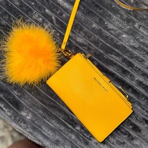 Michael Kors Vibrant Yellow Wristlet with Fluffy Pom Pom
